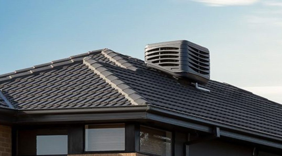 evaporative cooler on the roof of a house