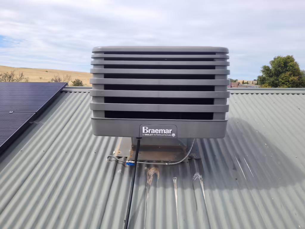 new Braemar evaporative cooler unit installed on a roof in Adelaide
