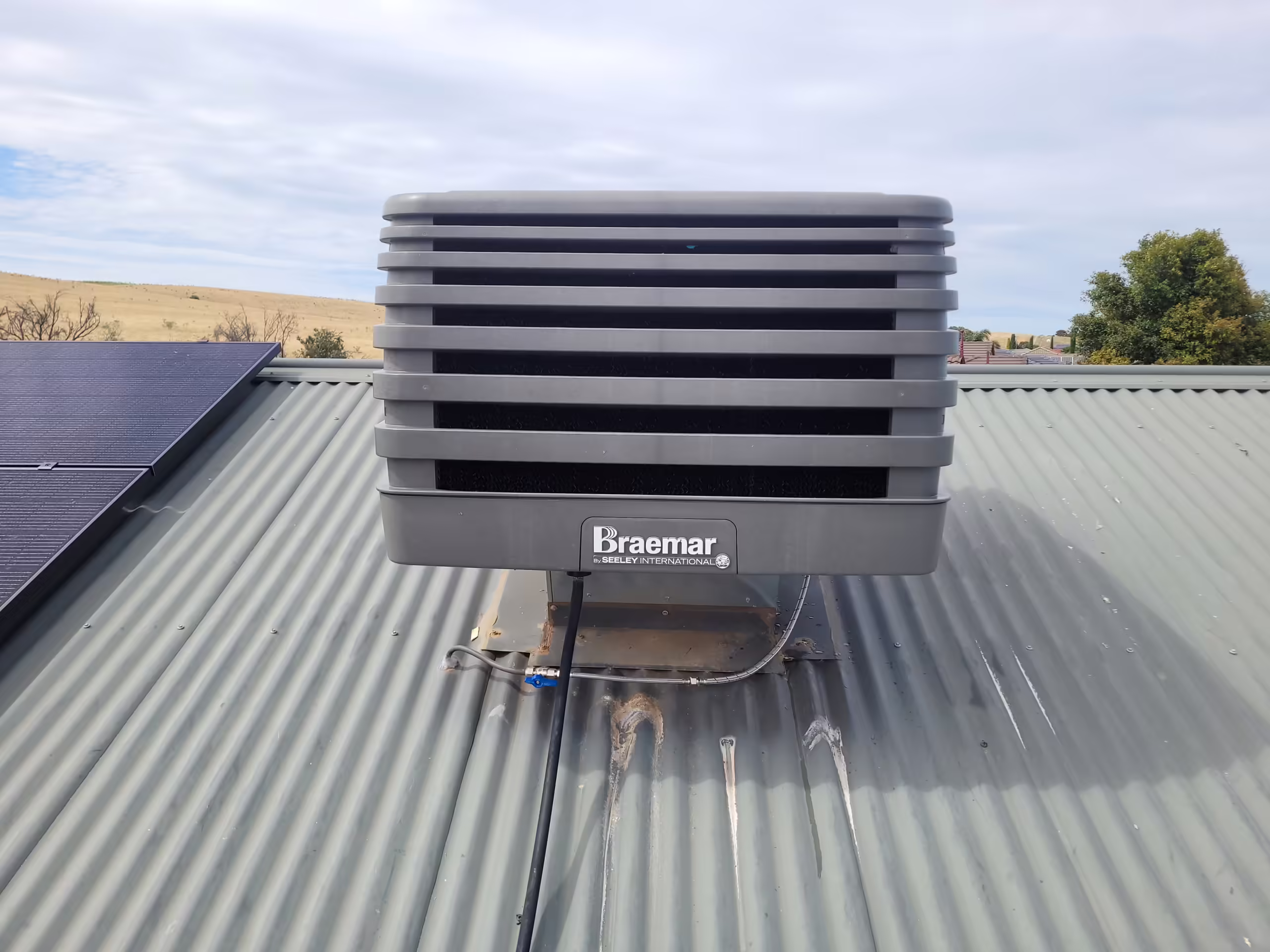 new Braemar evaporative cooler unit installed on a roof in Adelaide
